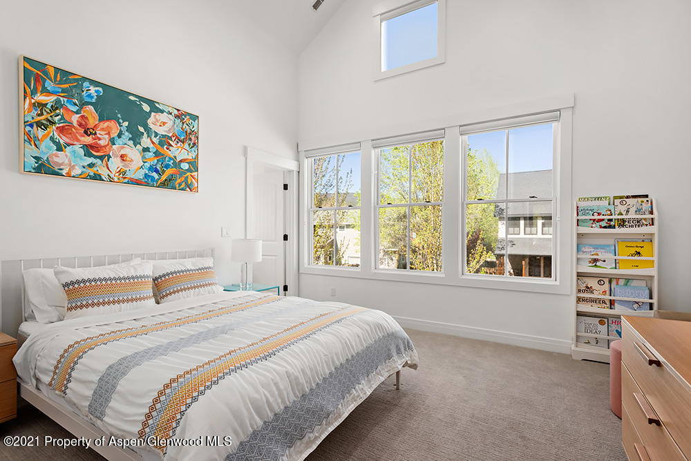 334 Sopris Circle Basalt, CO 81621 - Photo 20 of 34 a bedroom with a bed and a large window