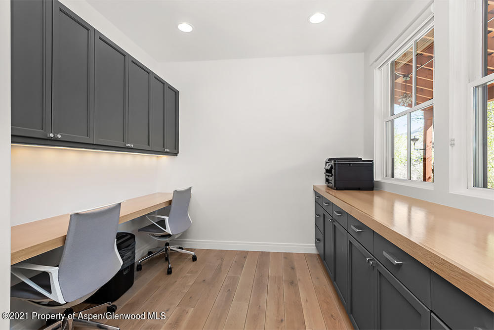 334 Sopris Circle Basalt, CO 81621 - Photo 25 of 34 a view of workspace with wooden floor and windows