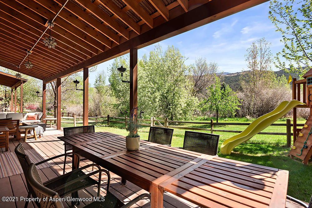 334 Sopris Circle Basalt, CO 81621 - Photo 28 of 34 a view of a patio with wooden floor and iron stairs
