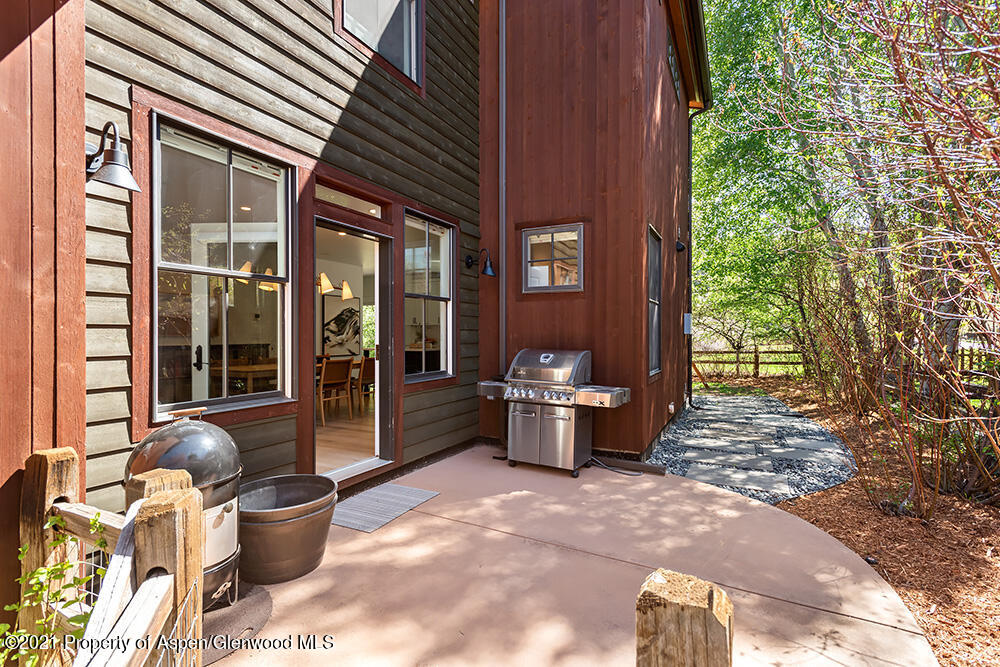 334 Sopris Circle Basalt, CO 81621 - Photo 34 of 34 a view of a patio with table and chairs and potted plants