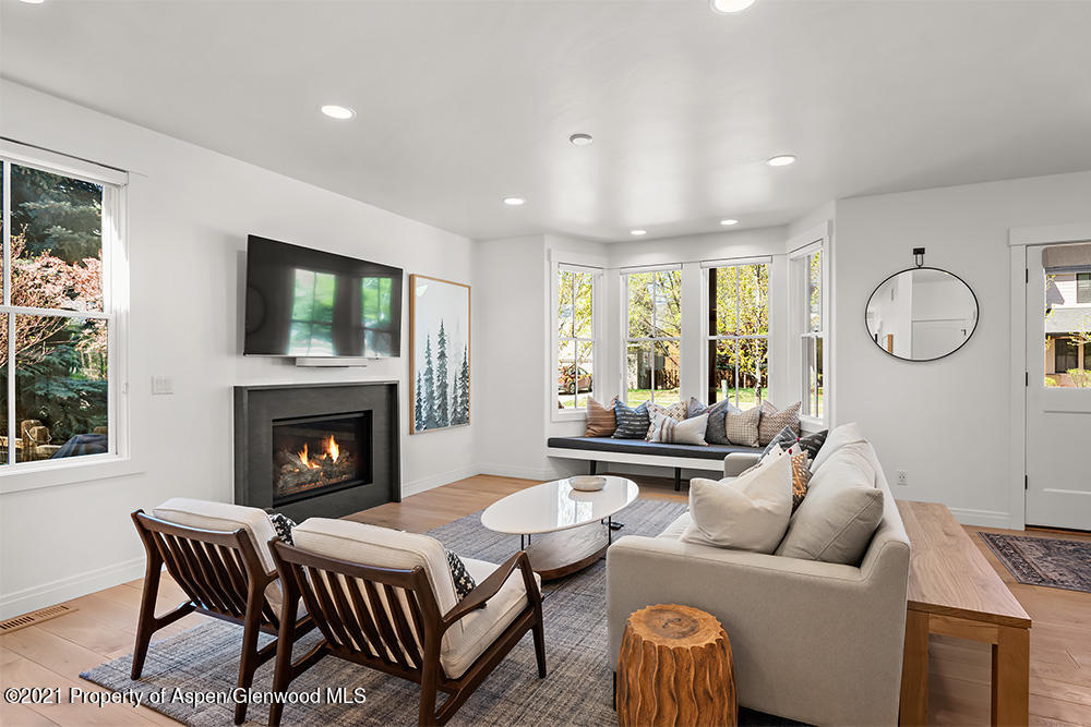334 Sopris Circle Basalt, CO 81621 - Photo 5 of 34 a living room with furniture fireplace and a large window