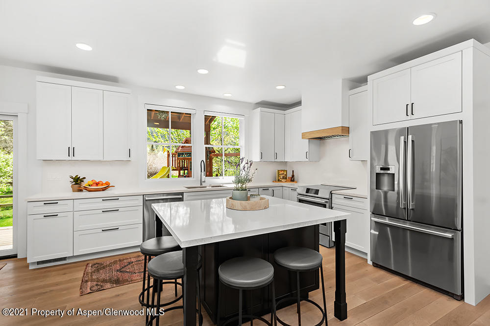 334 Sopris Circle Basalt, CO 81621 - Photo 6 of 34 a kitchen with granite countertop a sink appliances and cabinets