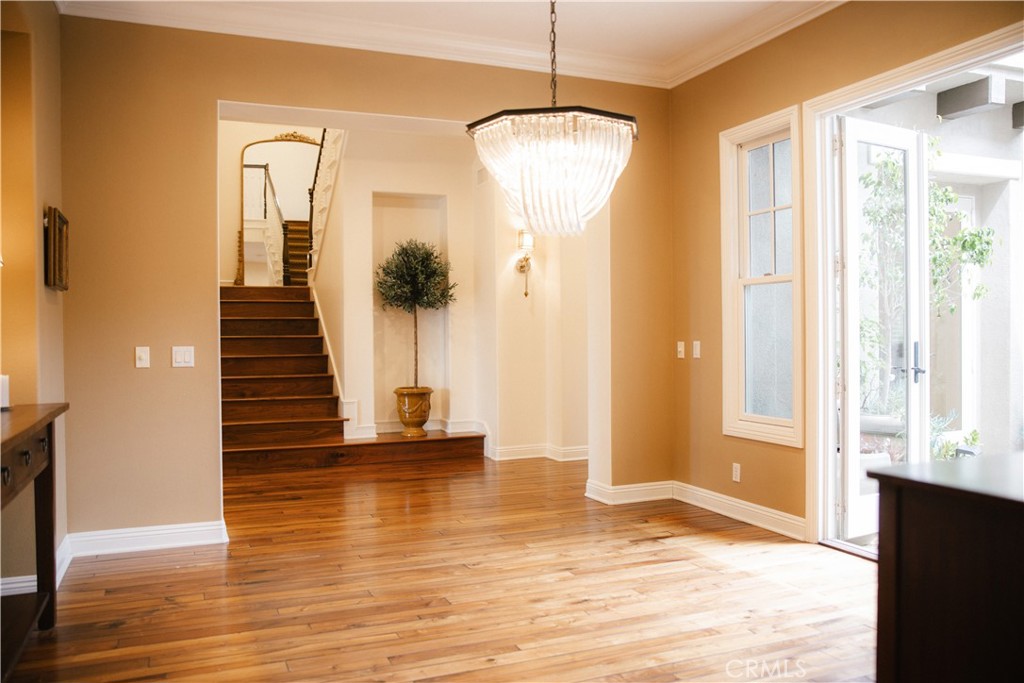 15 Pisano Street Ladera Ranch, CA 92694 - Photo 18 of 73 a view of a livingroom with wooden floor and stairs