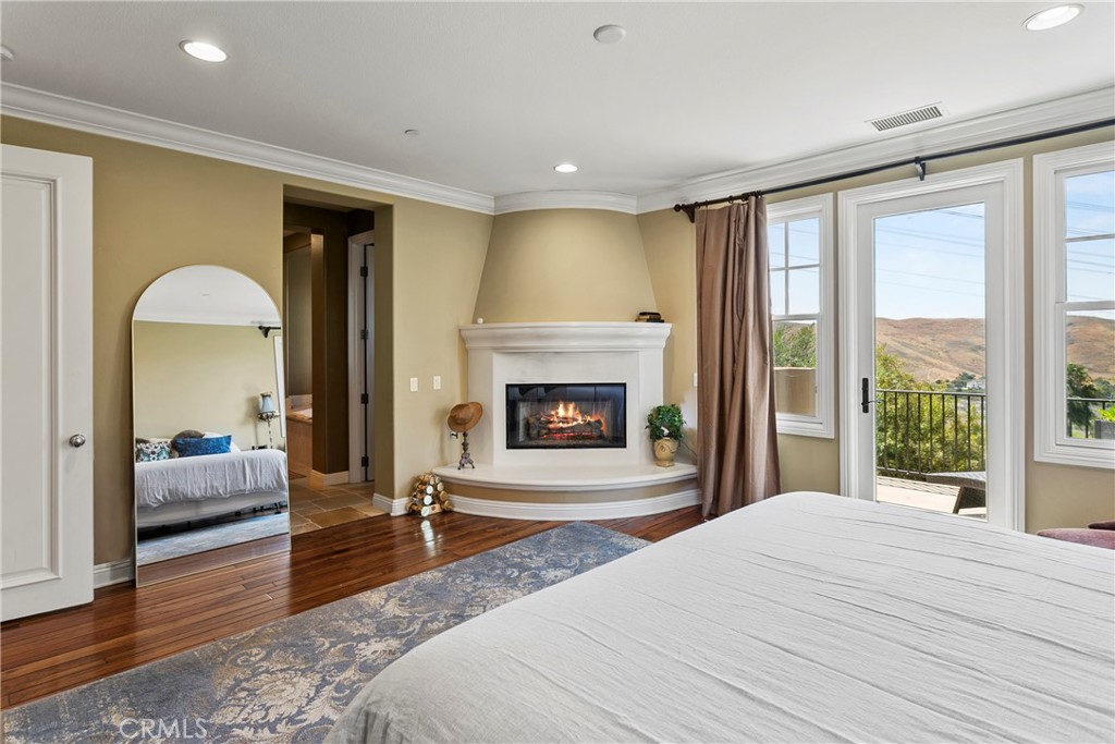 15 Pisano Street Ladera Ranch, CA 92694 - Photo 23 of 73 a spacious bedroom with a large bed and a large window