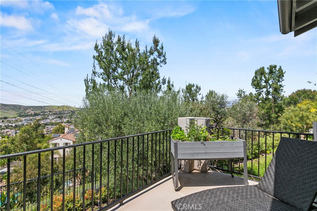 15 Pisano Street Ladera Ranch, CA 92694 - Photo 24 of 73 a view of a balcony with two chairs and a table