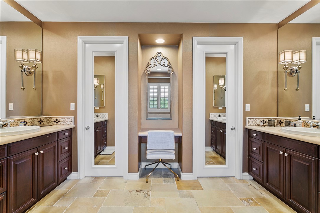 15 Pisano Street Ladera Ranch, CA 92694 - Photo 25 of 73 a spacious bathroom with a double vanity sink and a mirror