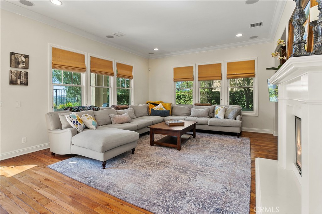 15 Pisano Street Ladera Ranch, CA 92694 - Photo 9 of 73 a living room with furniture and a fireplace