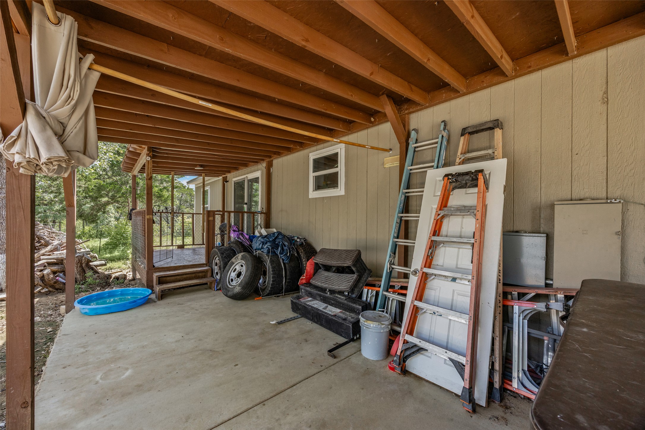 564 Boyd Road Red Rock, TX 78662 - Photo 13 of 25 A spacious covered concrete patio provides an ideal outdoor workspace or storage area.