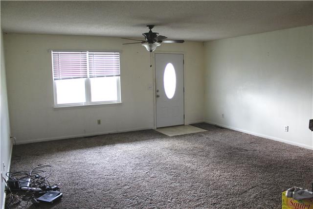 1463 Napier Road Hohenwald, TN 38462 - Photo 5 of 15 SPACIOUS LIVING ROOM WITH WARM AND COZY NEW CARPET