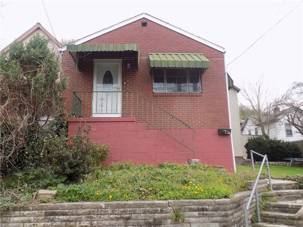 811 Lamont Street McKees Rocks, PA 15136 - Photo 1 of 20 a front view of a house with a yard
