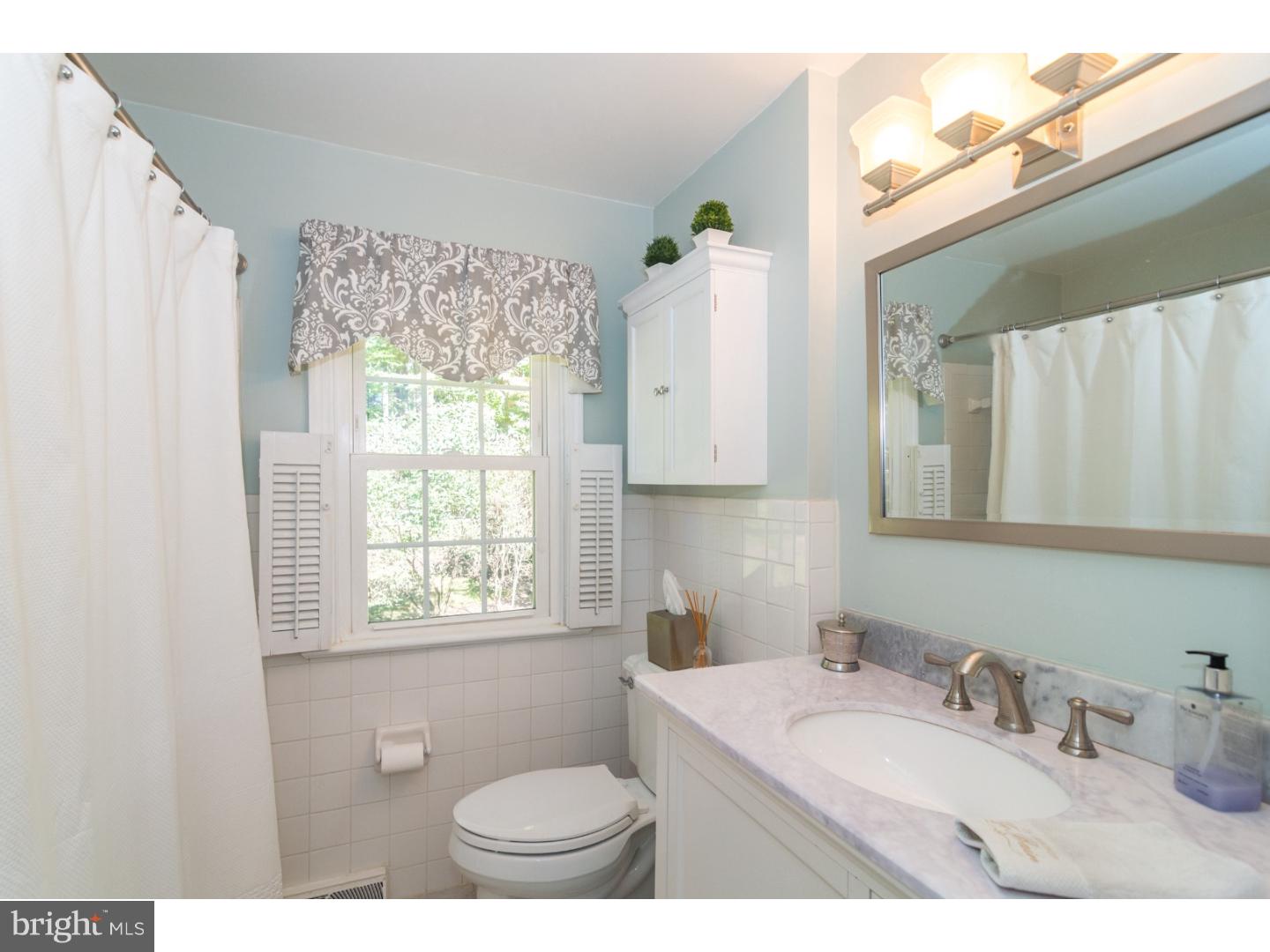 1901 Kimberwick Road Media, PA 19063 - Photo 22 of 25 a bathroom with a granite countertop sink toilet a mirror and a window