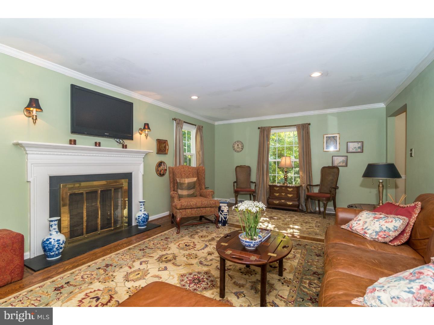 1901 Kimberwick Road Media, PA 19063 - Photo 6 of 25 a living room with furniture a flat screen tv and a fireplace