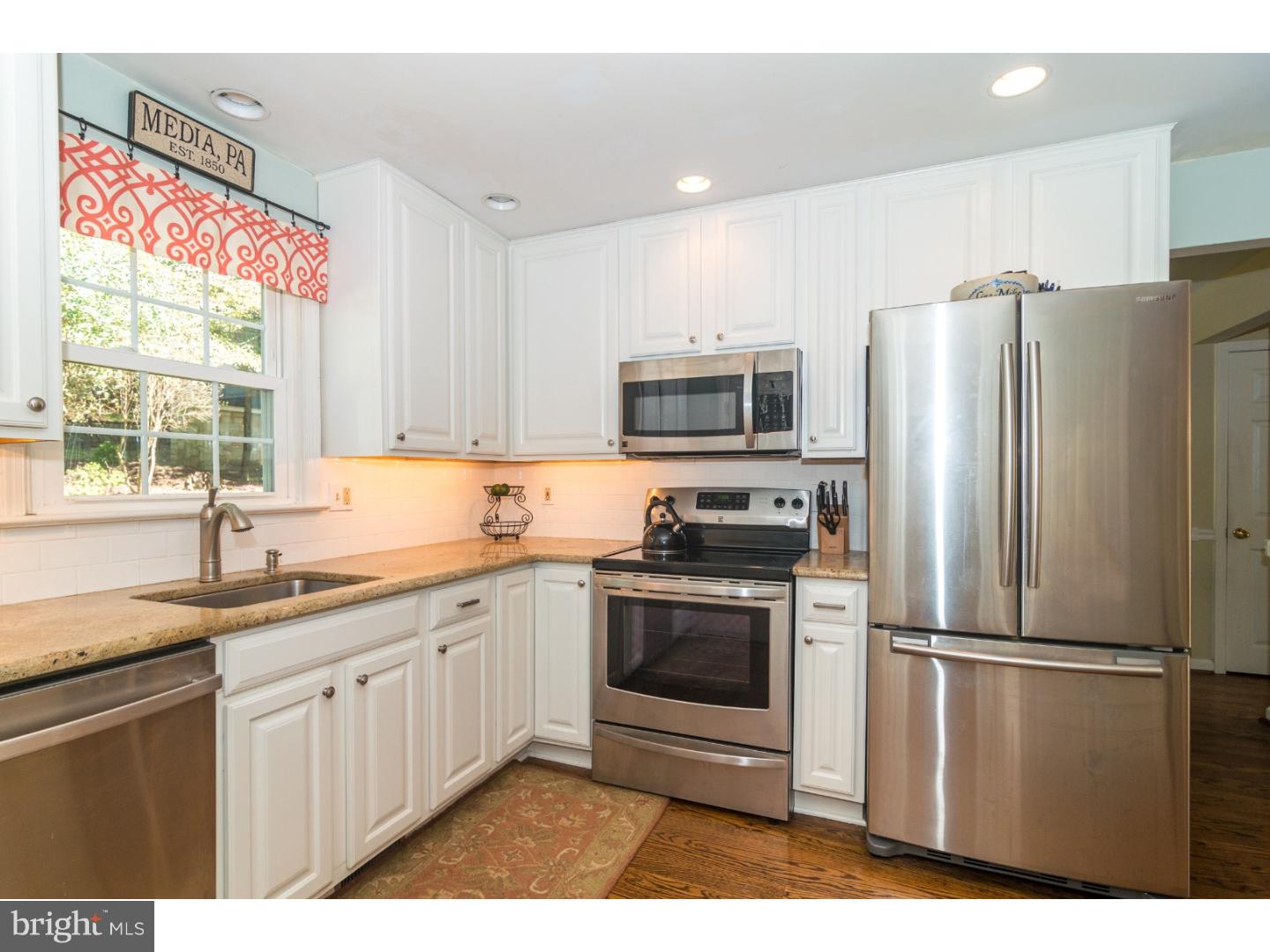 1901 Kimberwick Road Media, PA 19063 - Photo 8 of 25 a kitchen with stainless steel appliances granite countertop a refrigerator sink and stove