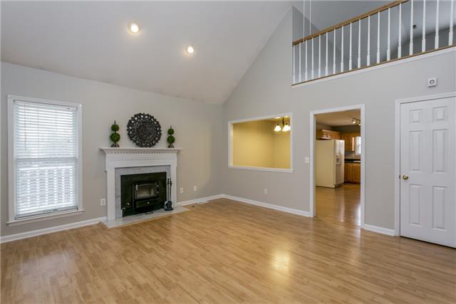 2027 Spring Meadow Circle Spring Hill, TN 37174 - Photo 2 of 20 Come on in and move right in! Your freshly painted home is inviting and spacious with it's vaulted ceilings. Natural light adds beauty to the space and the fireplace is perfect for cool nights to cozy up with family.