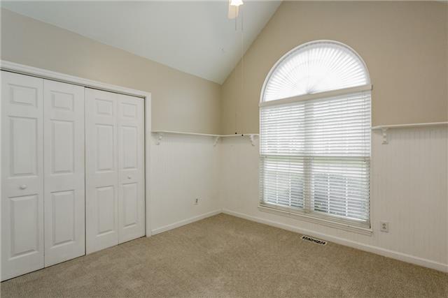 2027 Spring Meadow Circle Spring Hill, TN 37174 - Photo 11 of 20 What a charmer with lots of character! This bedroom features a vaulted ceiling, ceiling fan, beautiful bead-board molding with shelving to hold all your collectibles and mementos & a double Paladin window allowing for natural light to flood the spac