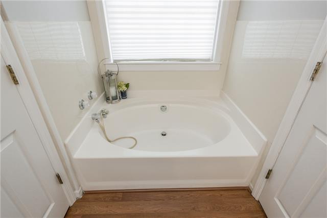 2027 Spring Meadow Circle Spring Hill, TN 37174 - Photo 8 of 20 The cozy master bath possesses all the amenities desired. The dual sink, garden tub, shower, and separate toilet area fulfill every desire. Take time to escape to a private setting as the stress flows away.