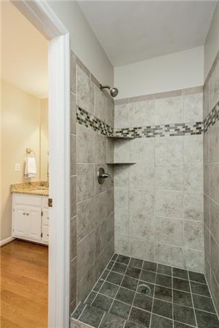 2027 Spring Meadow Circle Spring Hill, TN 37174 - Photo 9 of 20 A perfect 10 with granite counter-tops, double vanities, laminate flooring, beautiful tiled shower and a large window making for a cheery start to your day.