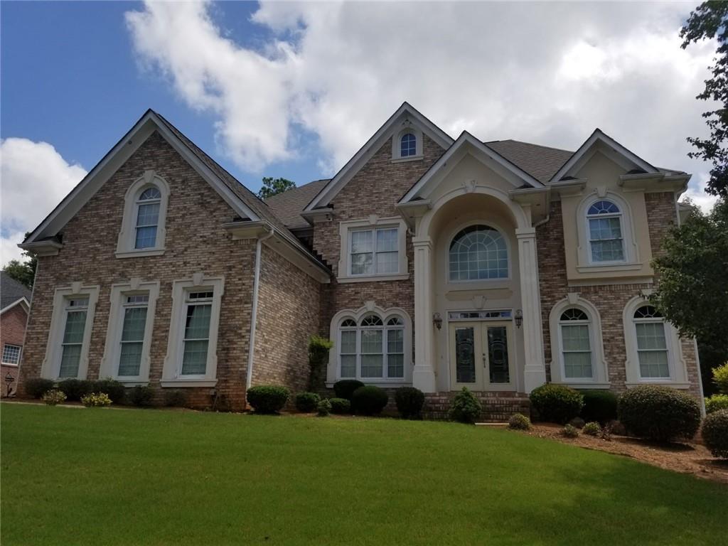 front view of a house with a yard