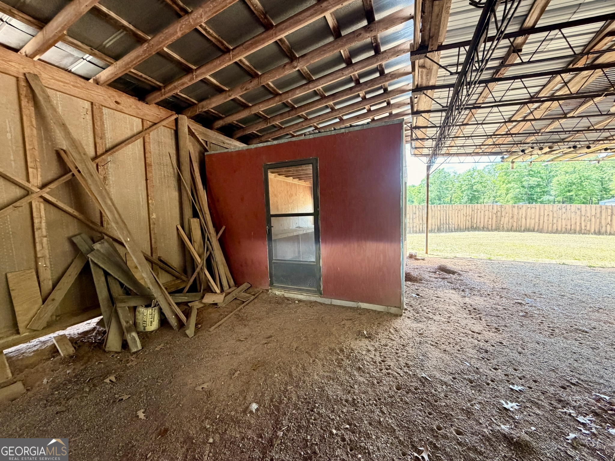 213 Stembridge Road Southeast Milledgeville, GA 31061 - Photo 25 of 83 a view of a room with wooden walls