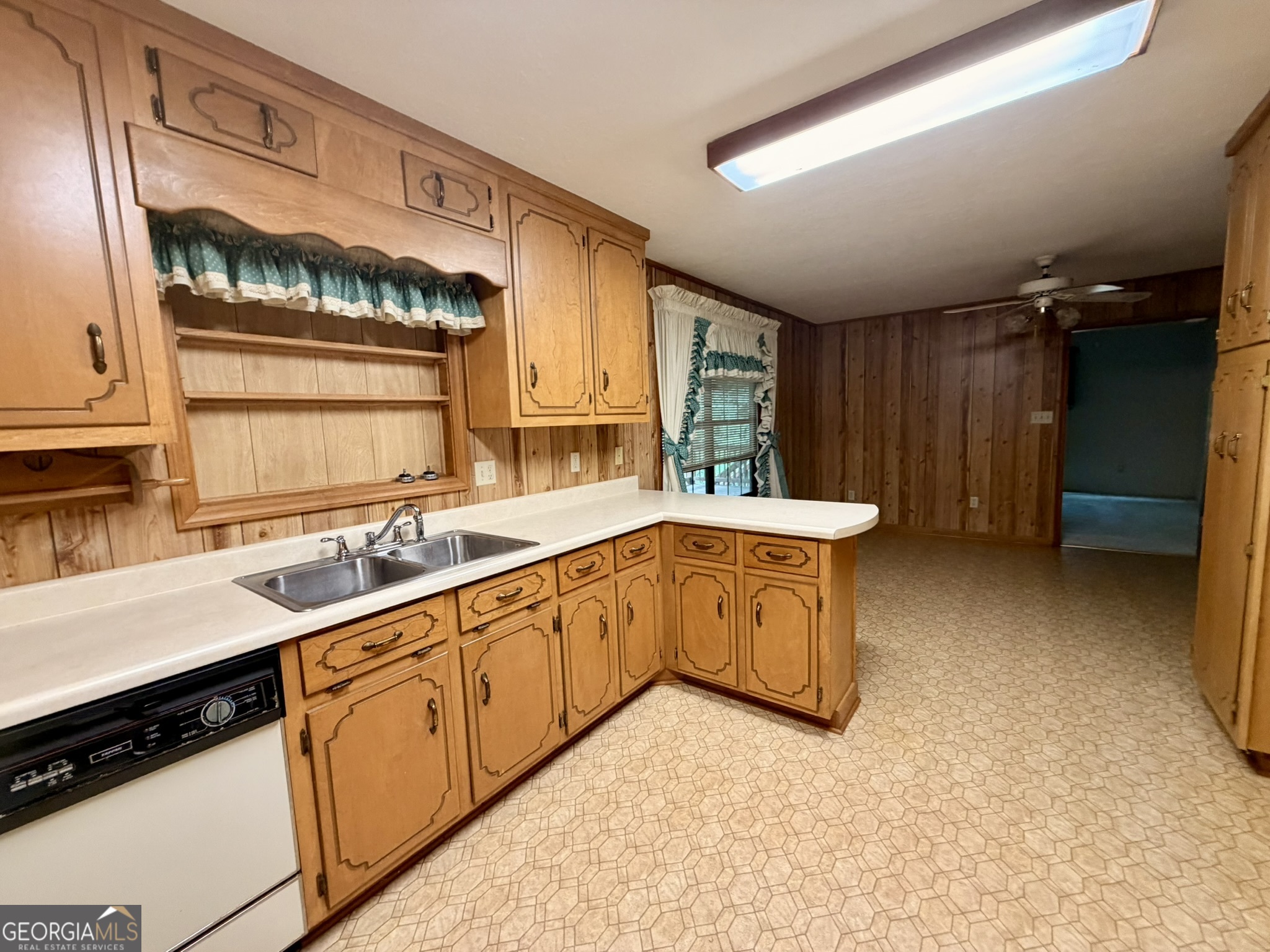 213 Stembridge Road Southeast Milledgeville, GA 31061 - Photo 5 of 83 a kitchen with sink cabinets and window