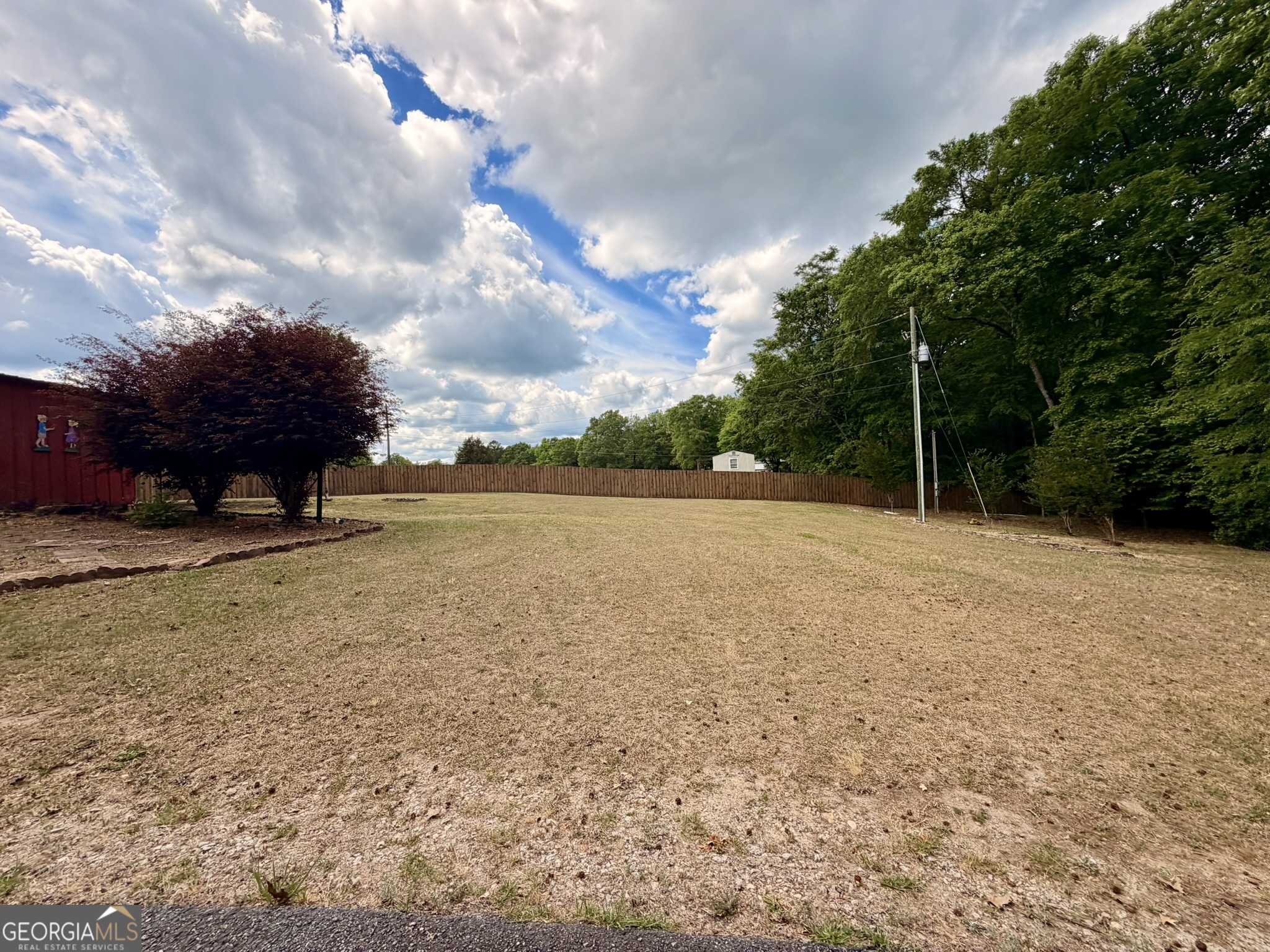 213 Stembridge Road Southeast Milledgeville, GA 31061 - Photo 60 of 83 a view of a lake with a big yard