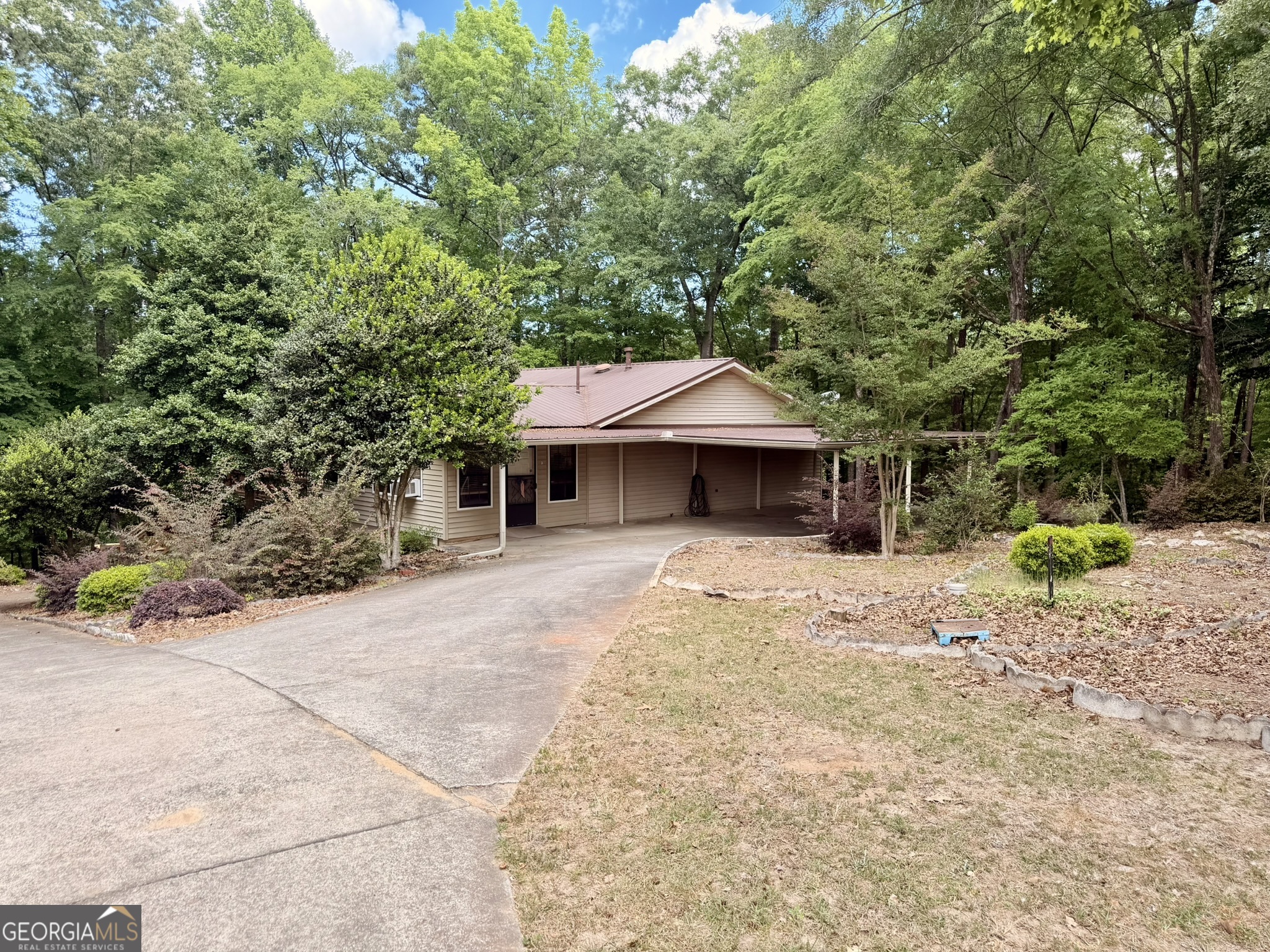 213 Stembridge Road Southeast Milledgeville, GA 31061 - Photo 63 of 83 a view of a house with a yard and sitting area