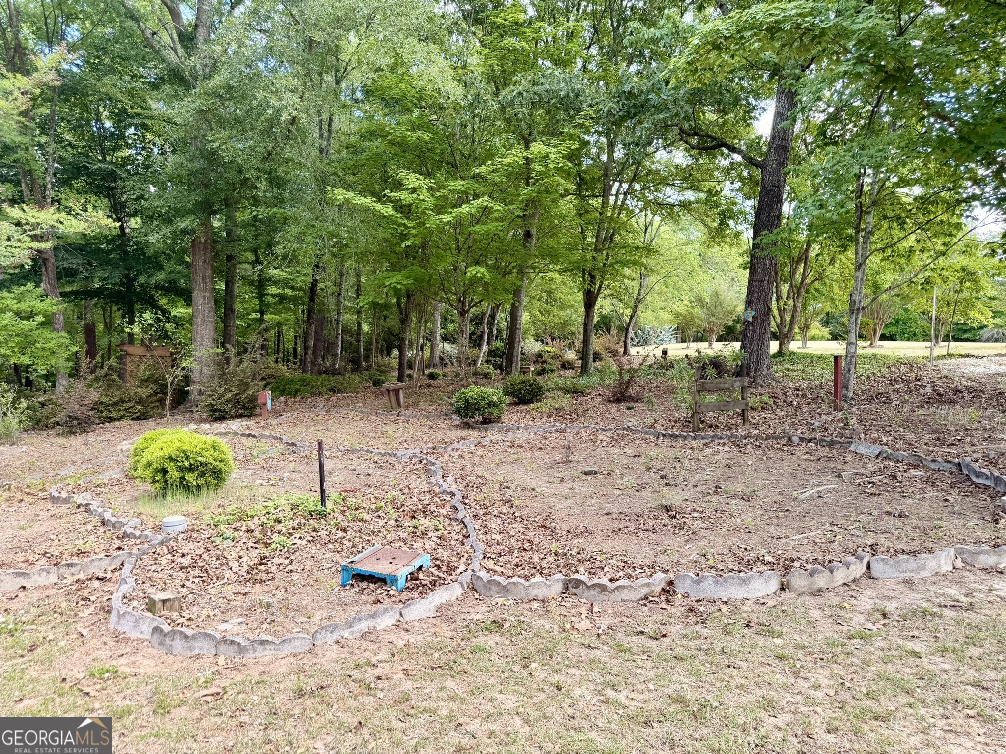 213 Stembridge Road Southeast Milledgeville, GA 31061 - Photo 64 of 83 a backyard of a house with lots of green space