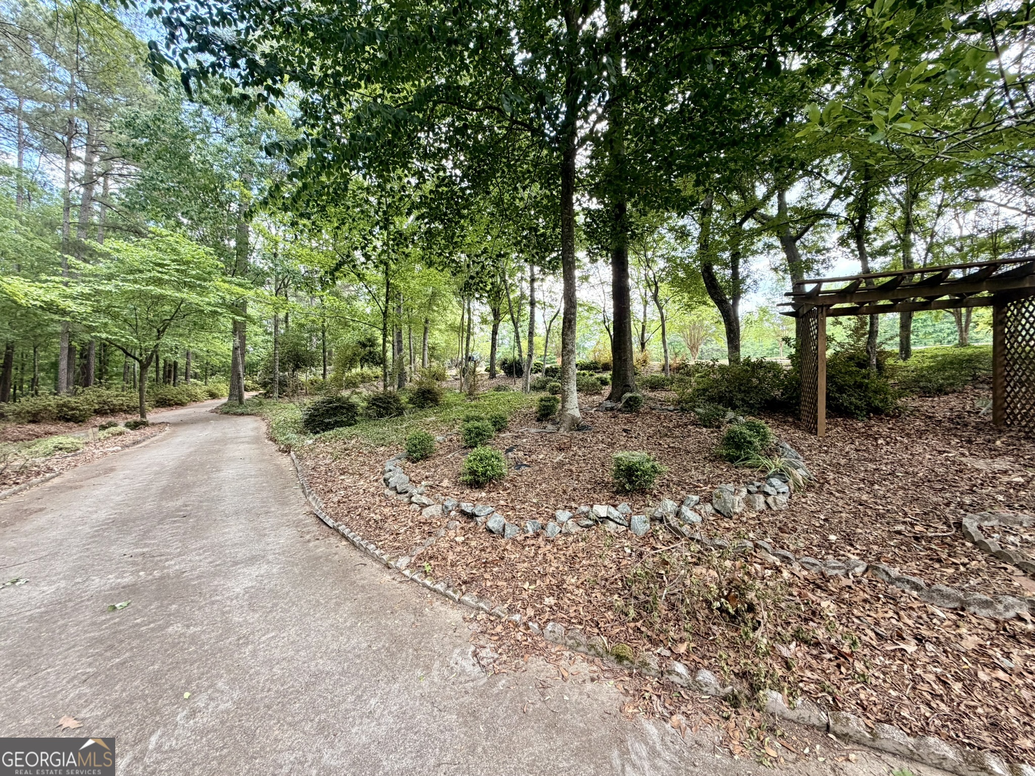 213 Stembridge Road Southeast Milledgeville, GA 31061 - Photo 77 of 83 a view of a road with trees in the background