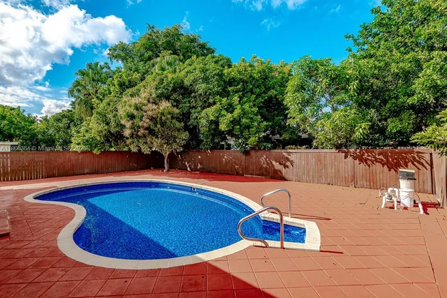 a view of swimming pool with seating space