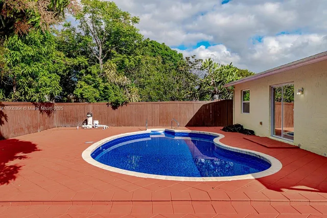 a view of outdoor space and swimming pool