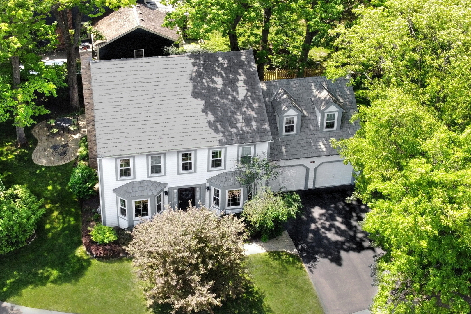 310 Concord Square Gurnee, IL 60031 - Photo 1 of 46 a aerial view of a house with a yard and potted plants