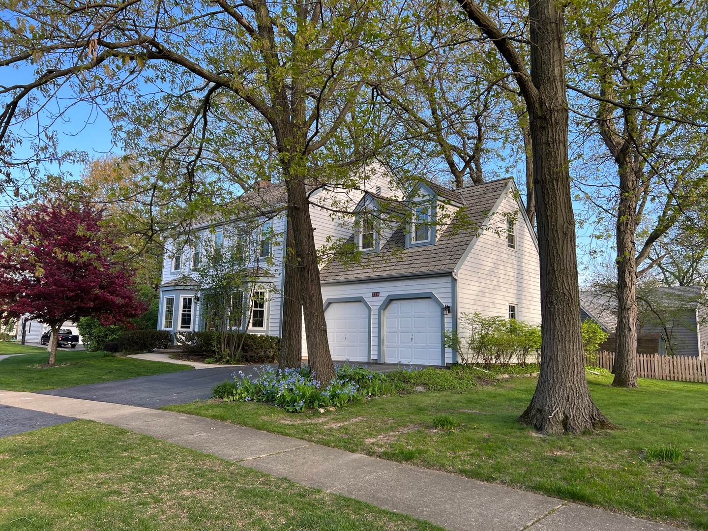 310 Concord Square Gurnee, IL 60031 - Photo 37 of 46 a front view of a house with a garden and trees