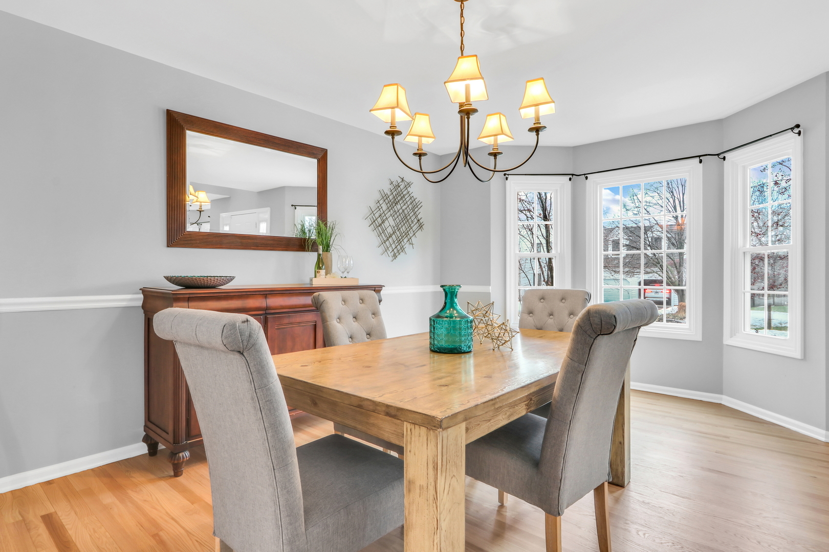 310 Concord Square Gurnee, IL 60031 - Photo 7 of 46 a view of a dining room with furniture wooden floor and chandelier