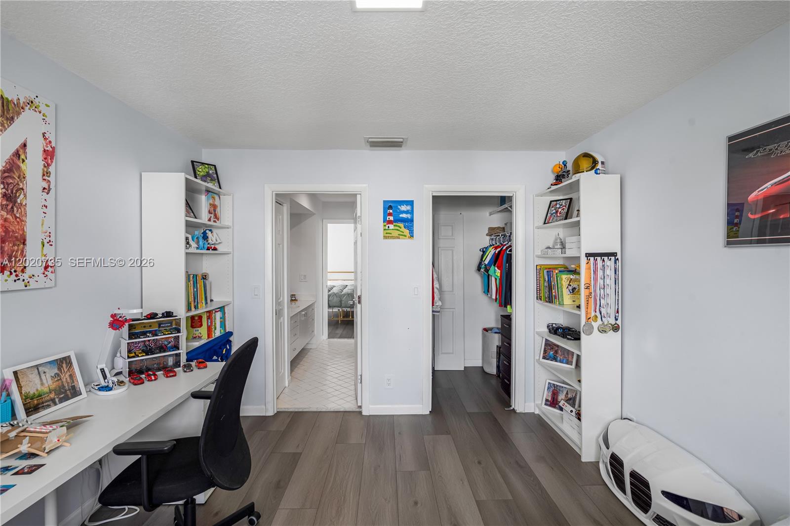 17244 Balboa Point Way Boca Raton, FL 33487 - Photo 51 of 66 a view of a workspace with furniture and wooden floor