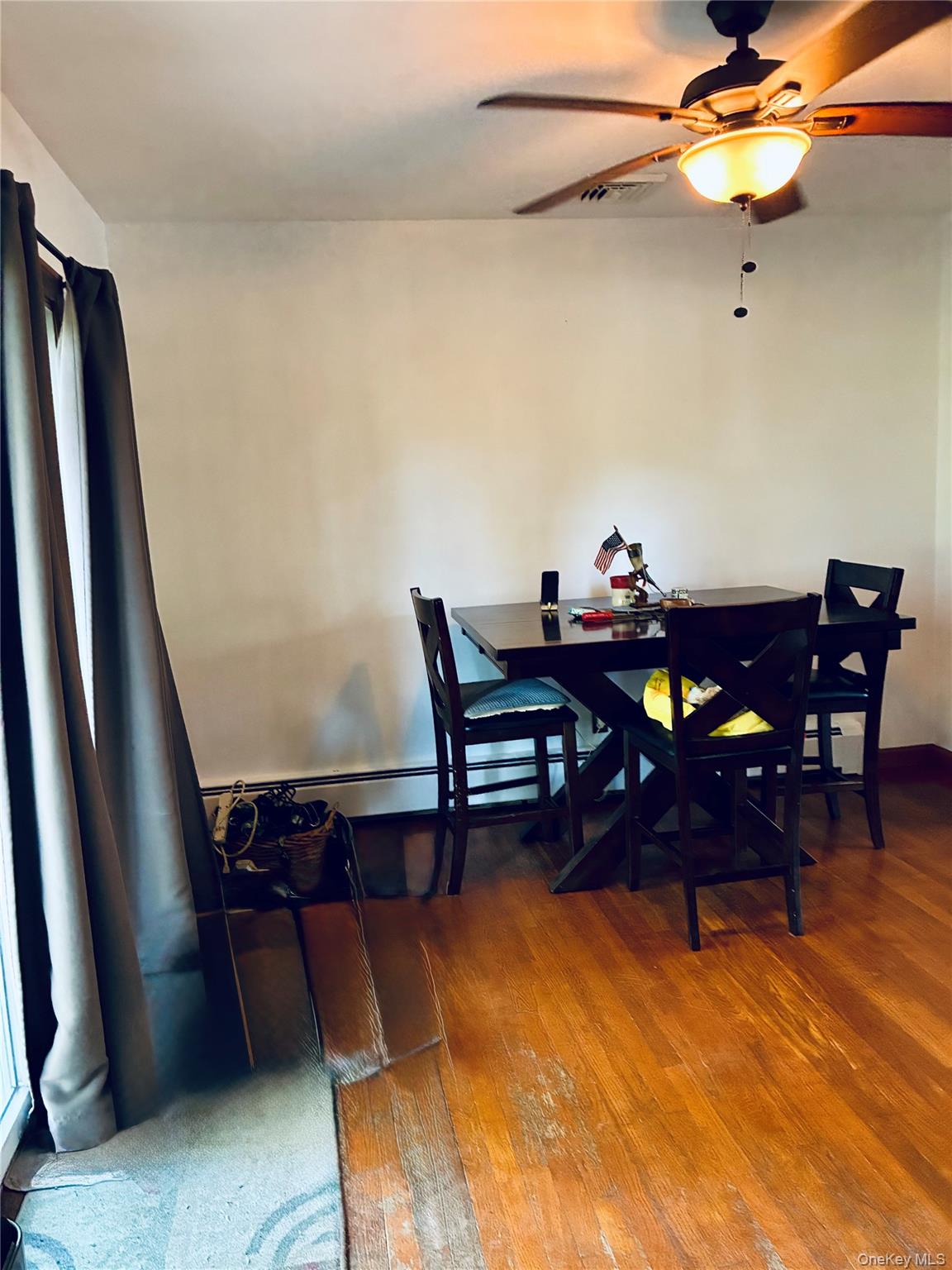 24 Ann Boulevard Spring Valley, NY 10977 - Photo 7 of 25 a view of a dining room with furniture and wooden floor