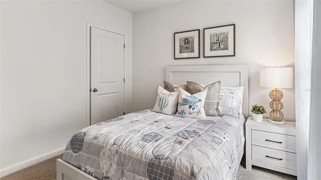 a bedroom with a bed and a dresser