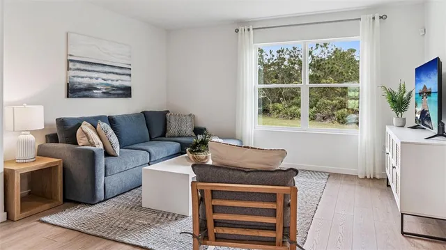 a living room with furniture and a window