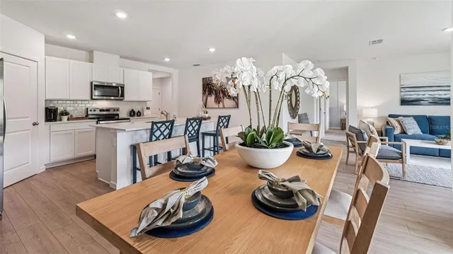 a kitchen with a table and chairs