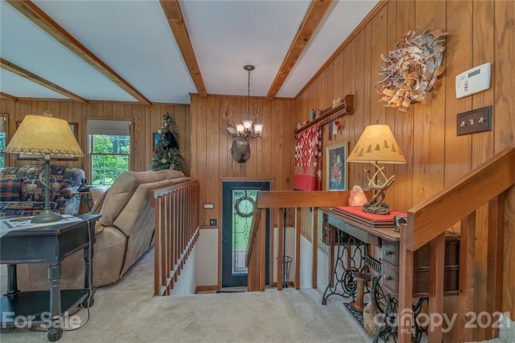 451 Robins Nest Road Bostic, NC 28018 - Photo 22 of 48 a dining room with furniture and a chandelier