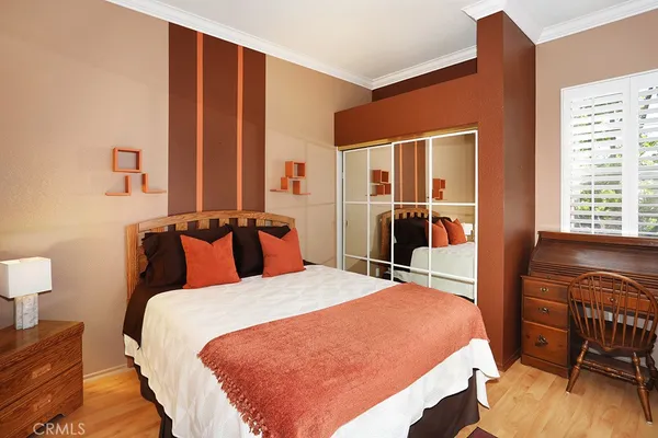 a view of a kitchen with wooden floor and a sink