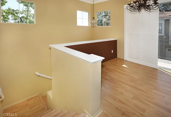 a bedroom with a bed and a night stand