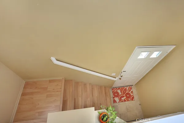 a bathroom with a toilet sink vanity and mirror