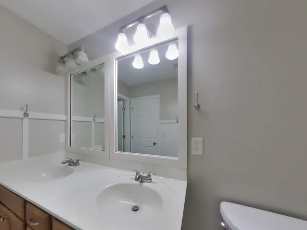a bathroom with a sink and mirror