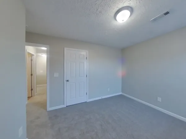 an empty room with a empty space and a window