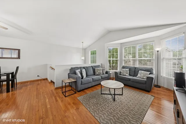 a living room with furniture and a rug