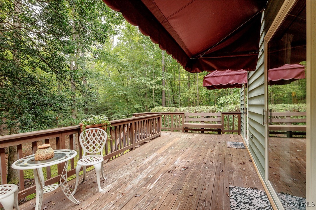 15721 Rowlett Road Chesterfield, VA 23838 - Photo 42 of 50 a view of a patio with table and chairs with wooden floor and fence