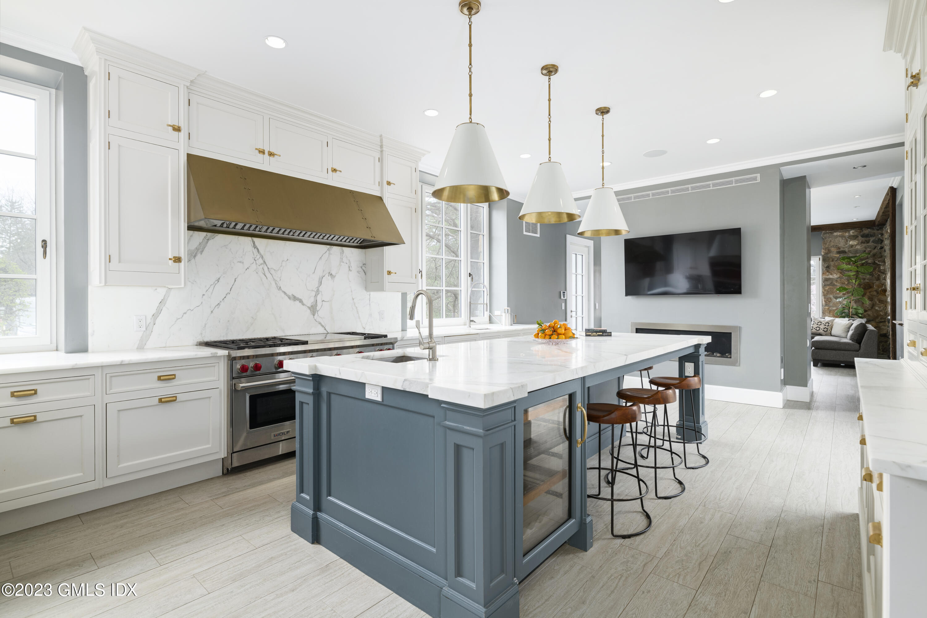 15 Upper Cross Road Greenwich, CT 06831 - Photo 12 of 39 a kitchen with stainless steel appliances granite countertop a stove and a wooden floor