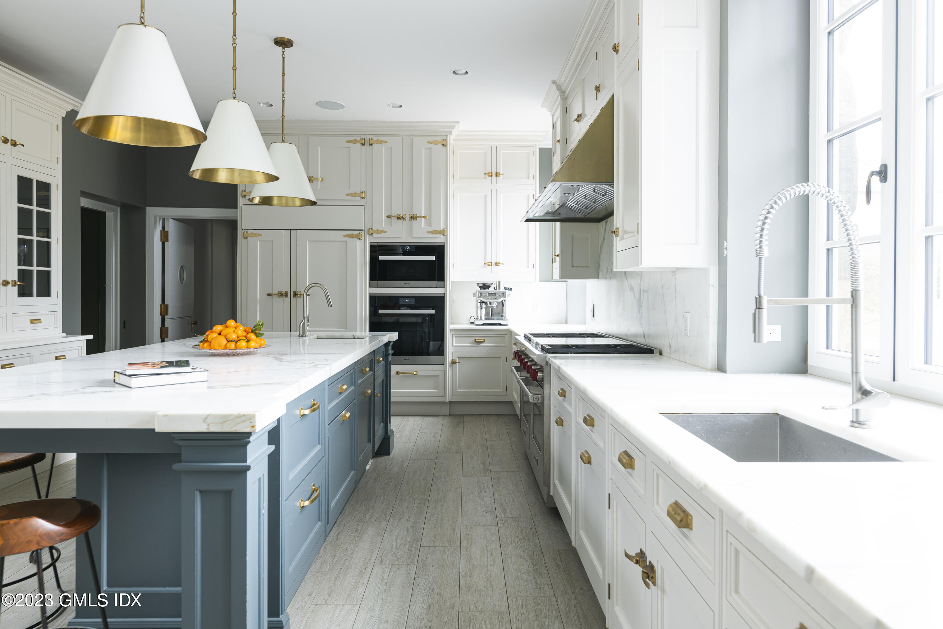 15 Upper Cross Road Greenwich, CT 06831 - Photo 13 of 39 a kitchen with stainless steel appliances granite countertop a sink and a refrigerator