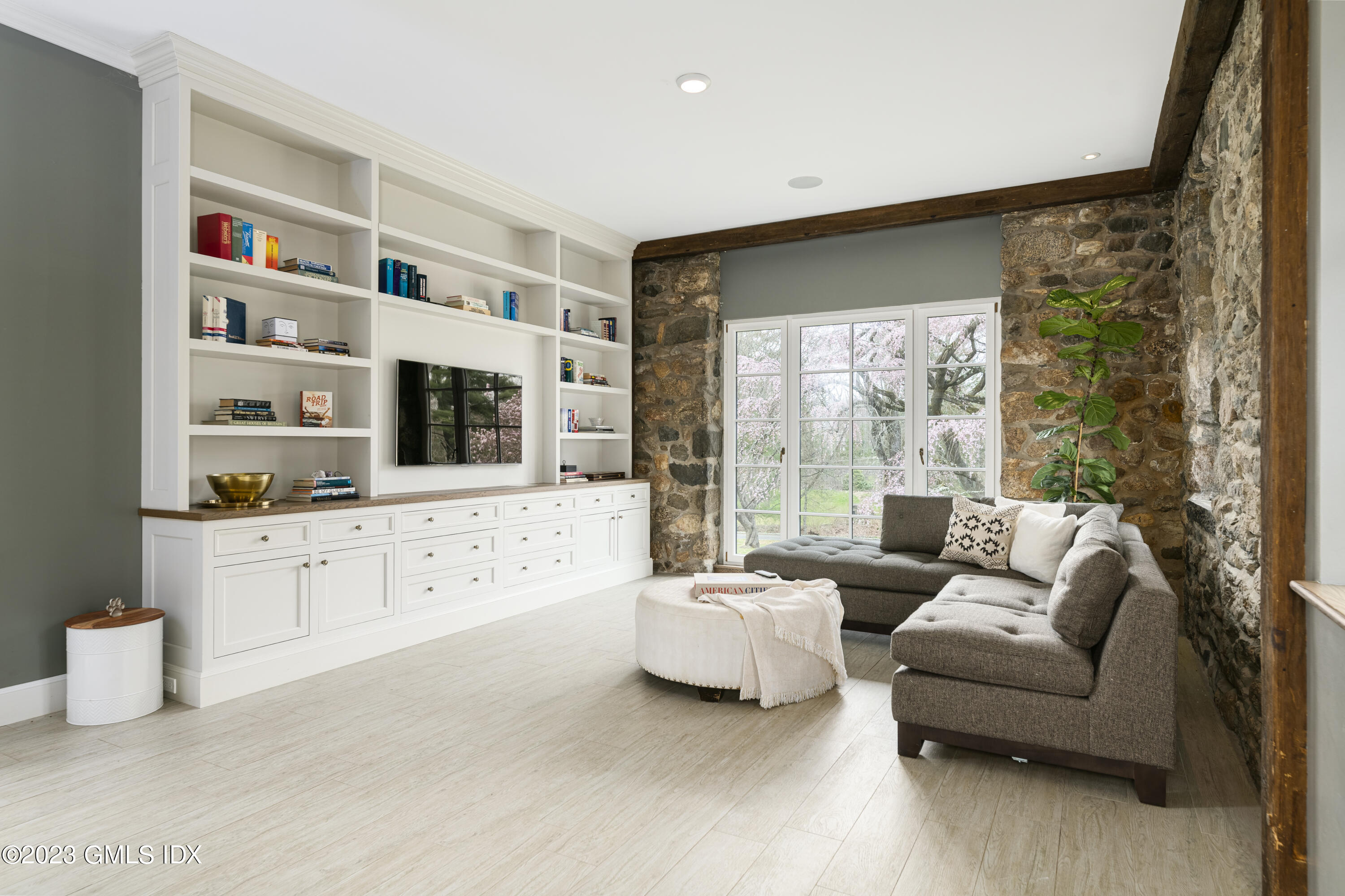 15 Upper Cross Road Greenwich, CT 06831 - Photo 14 of 39 a living room with furniture cabinets and a flat screen tv