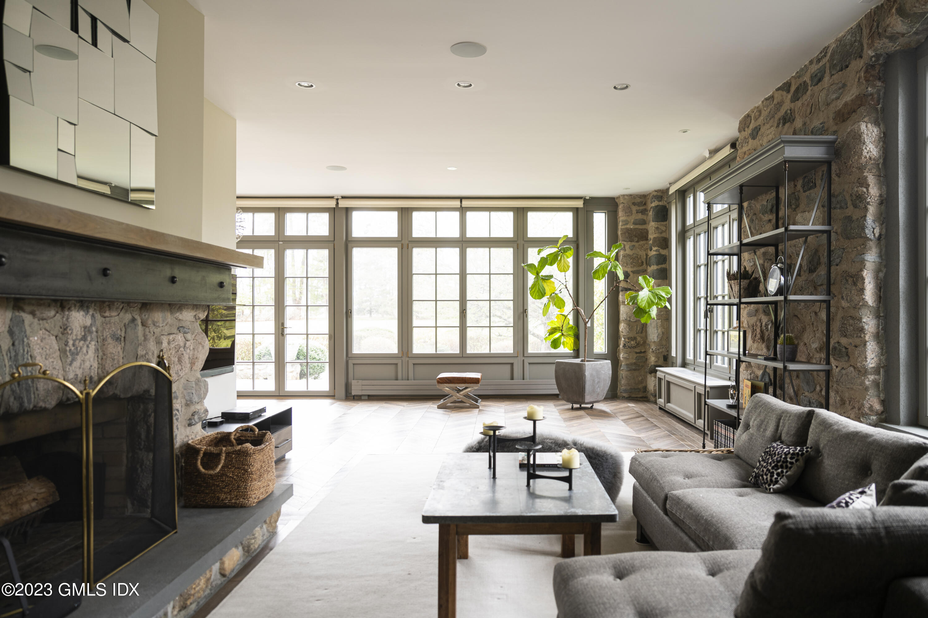 15 Upper Cross Road Greenwich, CT 06831 - Photo 19 of 39 a living room with furniture and a fireplace